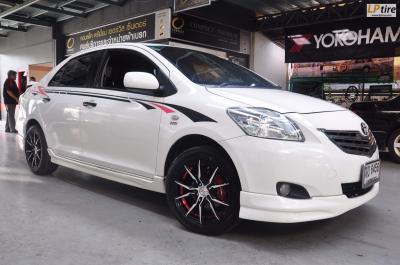 Toyota Vios + แม็ก TCK50190F ขอบ15 สีดำหน้าเงาอันเดอร์คัตแดง + ยาง DUNLOP LM704 195/55-15